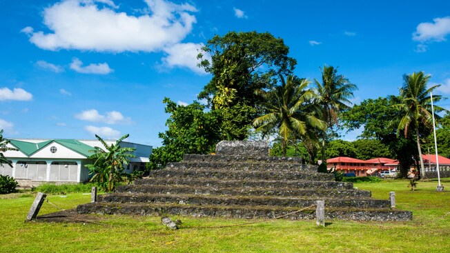 A park setting with a memorial mound