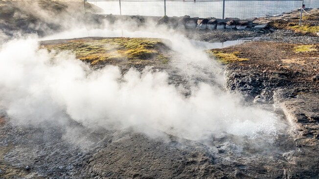 Steam rising from a rocky landscape