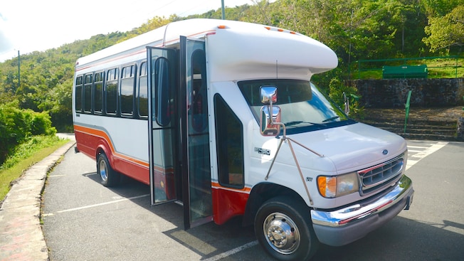 A bus with open doors parked along a street A bus with open doors parked along a street