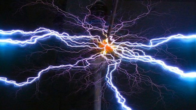 A vibrant Tesla coil creating high-frequency electrical currents A vibrant Tesla coil creating high-frequency electrical currents