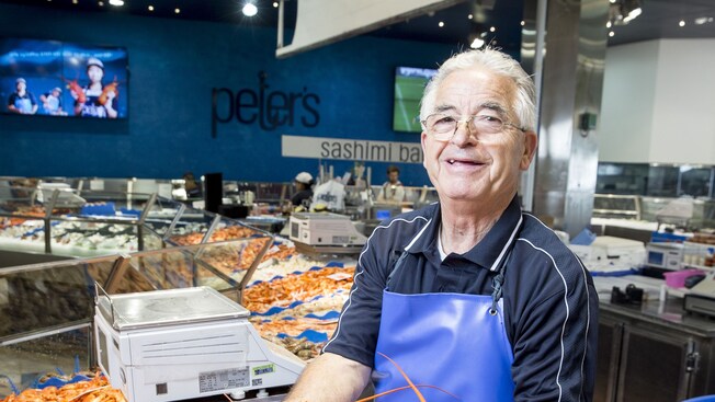 A fishmonger at the Sydney Fish Market in Pyrmont