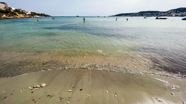 People enjoying a shallow water beach People enjoying a shallow water beach