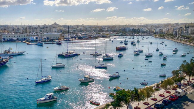 Boats of various sizes in a harbor