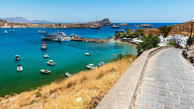 A cobblestone road along Lindos Beach in Rhodes, Greece