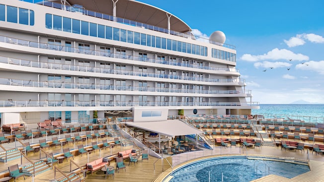Artist rendering of Wayfinder Bay on the deck of the Disney Adventure, featuring a large pool surrounded by lounge chairs and dining areas Artist rendering of Wayfinder Bay on the deck of the Disney Adventure, featuring a large pool surrounded by lounge chairs and dining areas