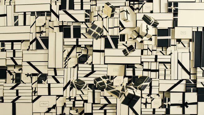 Graphic artwork featuring stacks of Jo Malone London signature boxes