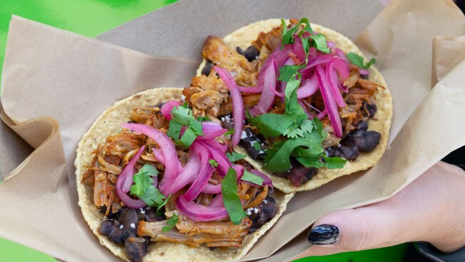 Two chicken tostadas made with chicken, black beans and fresco corn tortillas