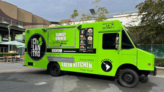 A food truck with signs that say ‘Urban Eatery,’ ‘Cilantro’ and ‘Latin Kitchen’