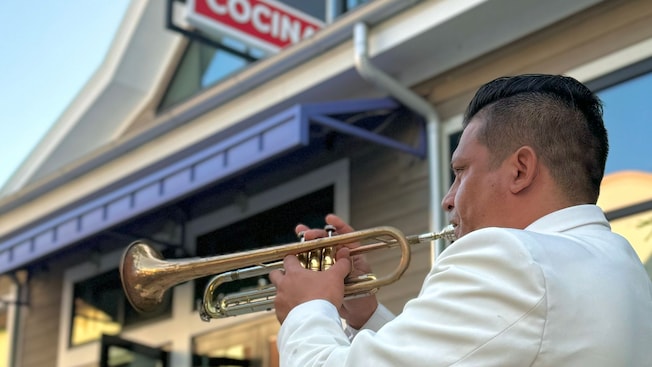 Musicians from a Mariachi band performing outside of Frontera Cocina