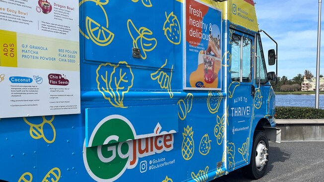 A GoJuice food truck parked near a body of water