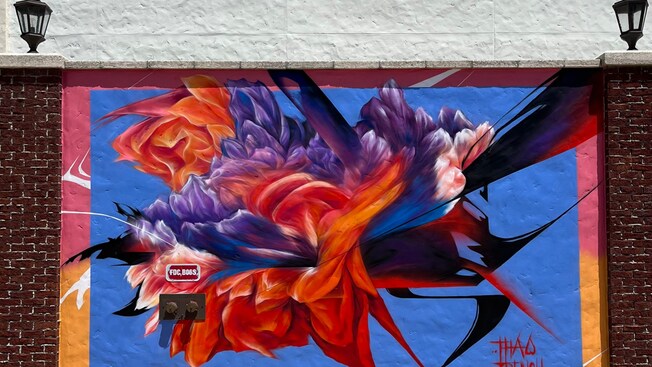 An abstract mural of a flower painted on a wall in Disney Springs at Walt Disney World Resort