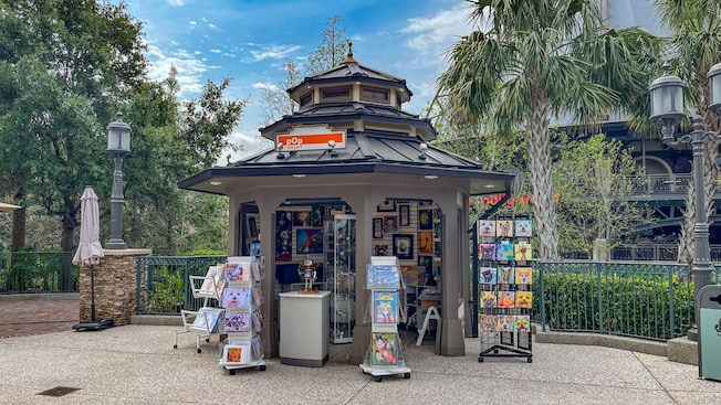 Pop Gallery at Disney Springs in Walt Disney World Resort featuring artwork lining the outdoor kiosk