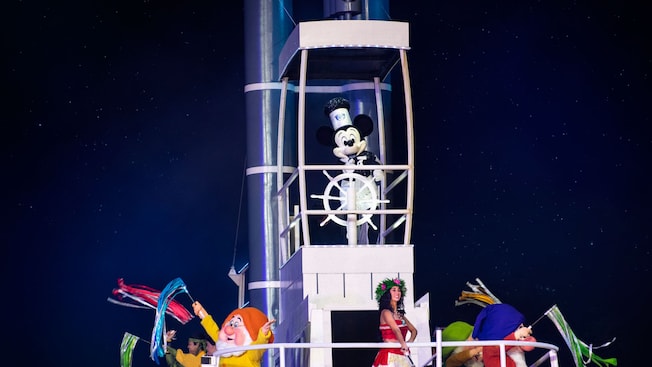 Mickey Mouse steers a steamboat carrying Moana and other Disney Characters