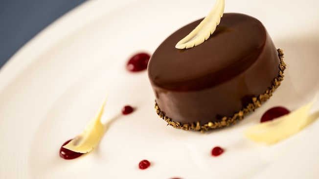 A Boston Cream Pie from Ale & Compass, garnished with white chocolate feathers