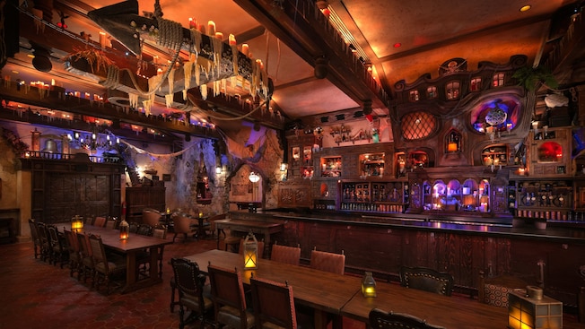 The interior of The Beak and Barrel, a pirate themed tavern decorated with relics such as a ship’s anchor, fishnets and candles