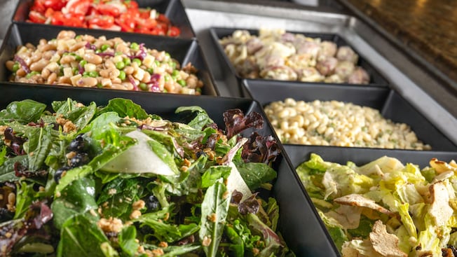 A buffet offering of seasonal salads from Biergarten Restaurant in Epcot