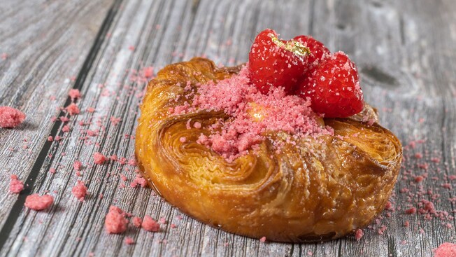 A danish topped with raspberries