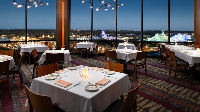A dining room in California Grill at Disney’s Contemporary Resort with views of Magic Kingdom park