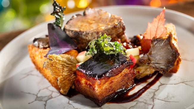 The Grilled Pork Tenderloin at California Grill, with creamy goat cheese polenta, roasted pork belly, aged balsamic, organic mushrooms and zinfandel glaze