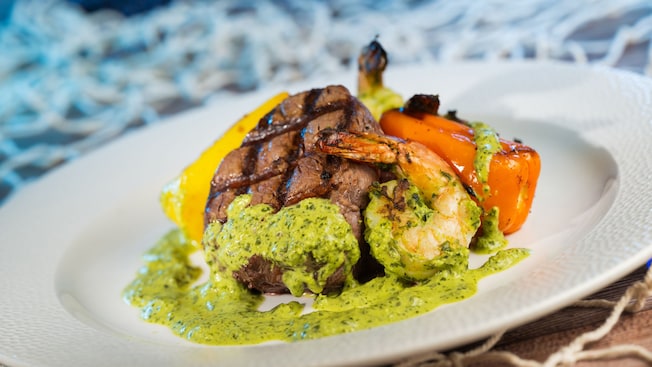 Coral Reef Restaurant’s Surf and Turf with filet mignon, shrimp, garlic mashed potatoes and chimichurri sauce