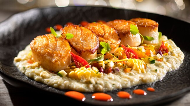Plancha seared scallops with grits, sweet corn and peppadew sauce