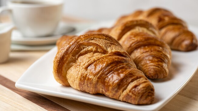 Three croissants on a plate