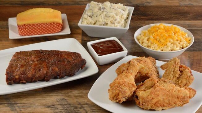 Dishes filled with Fried Chicken, Macaroni and Cheese, Corn Bread, Mashed Potatoes and more