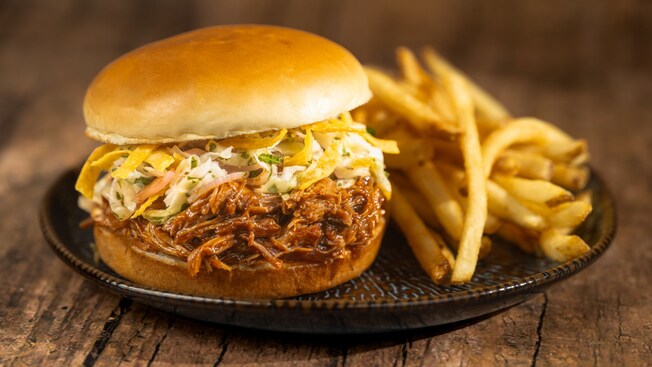 The Coca Cola Cherry Braised Pork Sandwich with fries from Pecos Bill Tall Tale Inn and Cafe