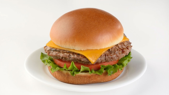 A cheeseburger with tomato and lettuce