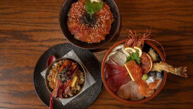 Three bowls containing Japanese rice dishes