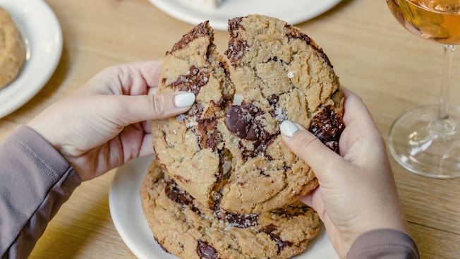 Several cookies on a wood serving platter