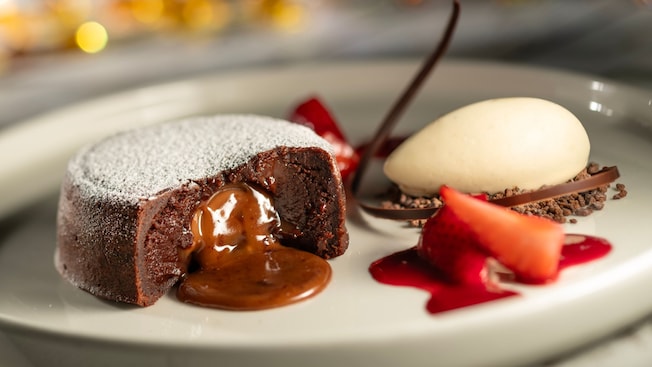 Warm Chocolate Cake from Topolino’s Terrace, Flavors of the Riviera, served with vanilla bean ice cream and strawberries