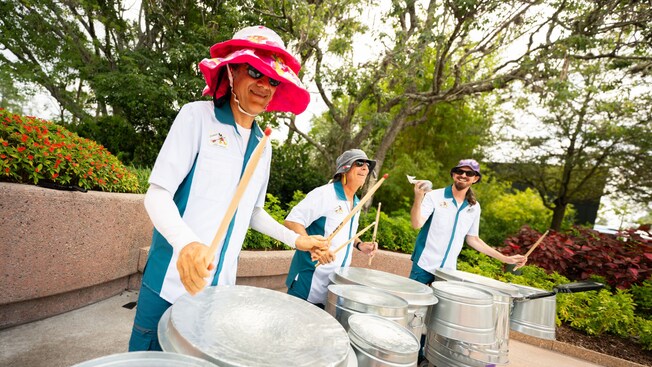 Percussion ensemble The Jammitors using stainless steel trash cans to perform music at Epcot