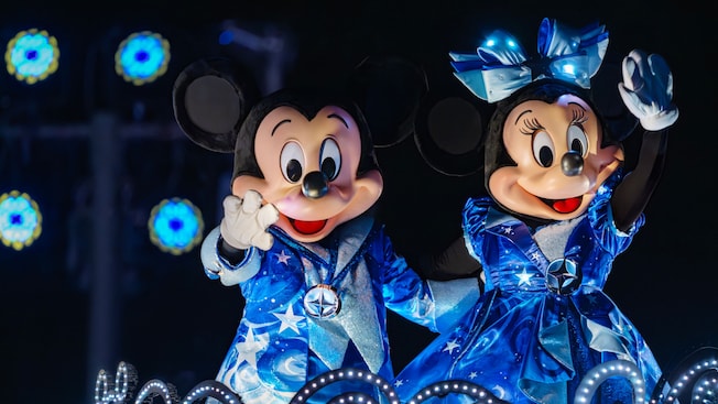 Mickey Mouse and Minnie Mouse on a float in the Disney Starlight, Dream the Night Away parade at Magic Kingdom park