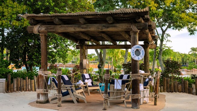 Beachcomber Shack 5, a shaded private cabana with lounge chairs at Disney's Typhoon Lagoon water park