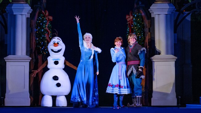 Olaf, Elsa, Anna and Kristoff on stage at Frozen Holiday Surprise