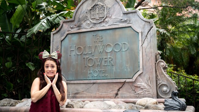  A Guest poses in front of the sign for The Twilight Zone Tower of Terror