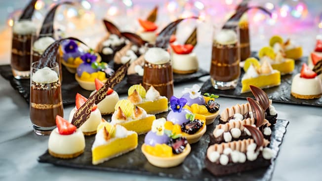 Several miniature desserts, including Key Lime Tart and Brownie Espresso Bar, lined up in rows