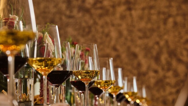 A row of wine glasses on a dining table in Ravello at the Four Seasons Resort Orlando