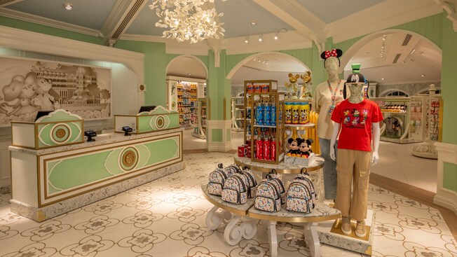 The interior of M Mouse Mercantile gift shop reveals mannequins, shelves and counters displaying Mickey and Minnie Mouse merchandise