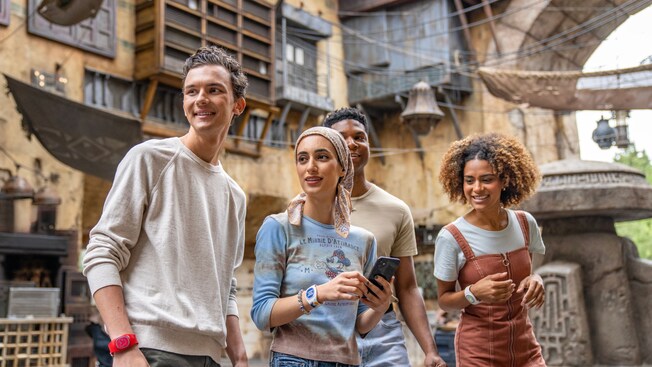 Four Guests walking through Star Wars: Galaxy's Edge