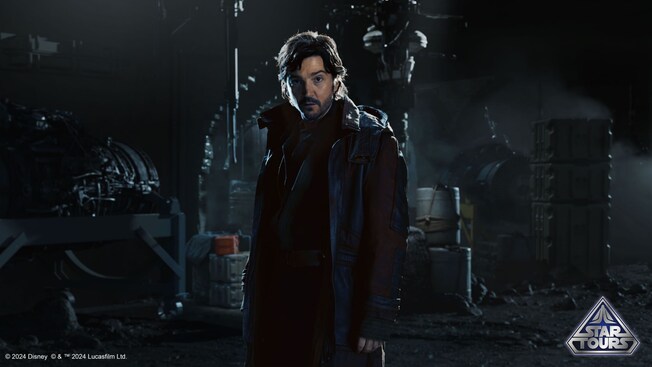 Cassian Andor with a Star Tours icon
