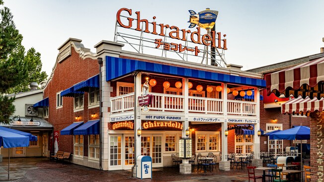 Lit up at night, outdoor signage for Ghirardelli Soda Fountain and Chocolate Shop, located in San Fransokyo Square at Disney California Adventure Park