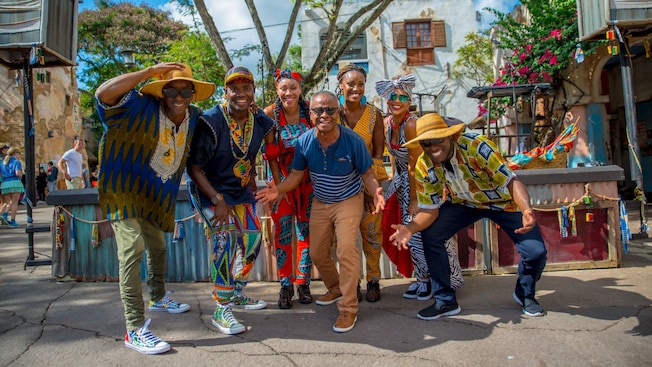 The members of Wassalou, an Afropop band, pose for a photo in Disney’s Animal Kingdom theme park
