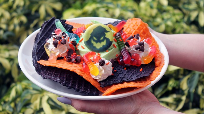 Waffle cone chips topped with DOLE Whip, whipped cream, gummy worms and an Oogie Boogie candy
