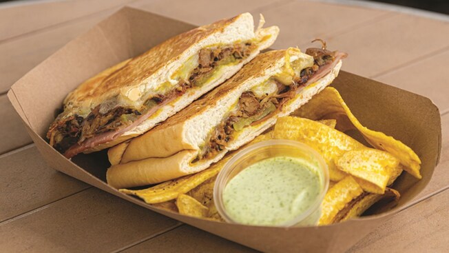 The Sandwich Cubano with plantain chips and avocado dip from Cilantro Urban Eatery Food Truck