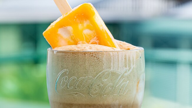 An Orange Cream Float on a counter from the Coca Cola Store Rooftop Beverage Bar