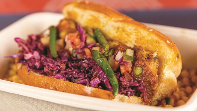 A Rock Shrimp Sloppy Joe sandwich with vegetables from eet by Maneet Chauhan