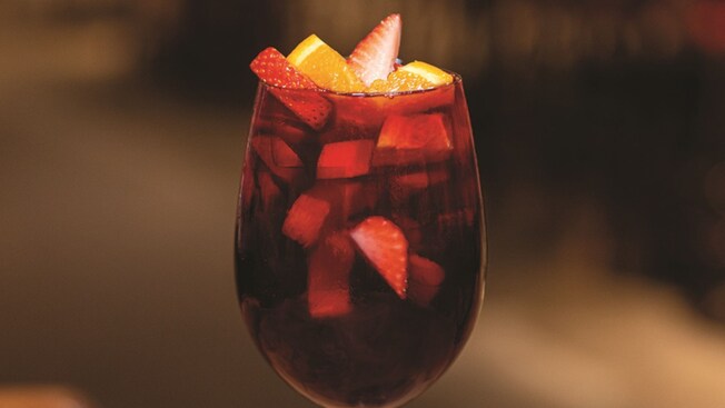 A glass of Southeastern Sangria with fruit from Enzo’s Hideaway and Maria & Enzo’s Ristorante