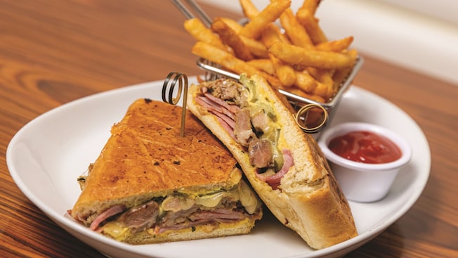 A Cubano sandwich and French fries on a plate from STK Steakhouse